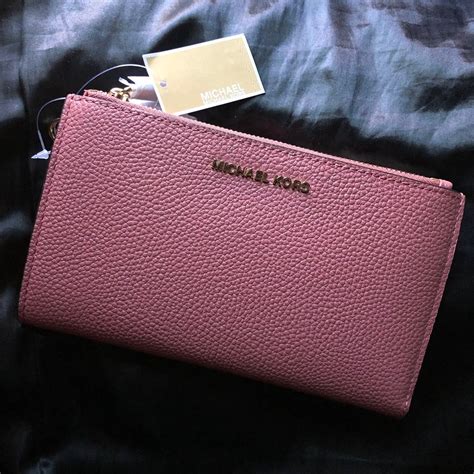 rose print michael kors wallet|Michael Kors pink wristlet wallet.